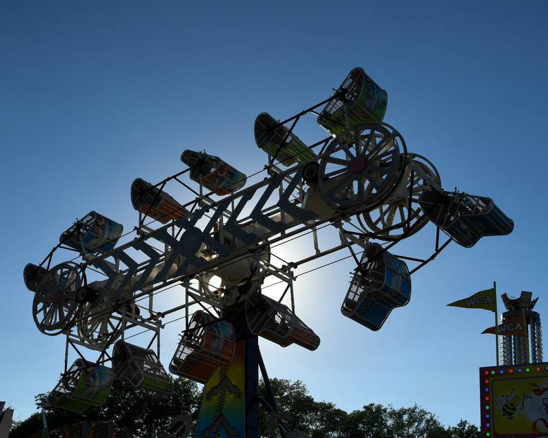 Prairie Fest attendees enjoy the zipper ride on Friday June 17, 2022 in Oswego.