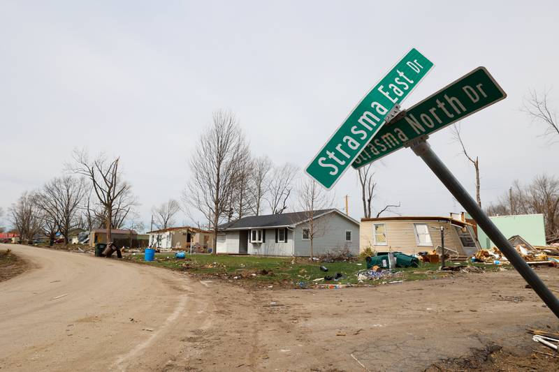 Homes along Strasma North Drive in Aroma Township are shown on April 8, 2026, nearly one month after the EF-3 tornado.