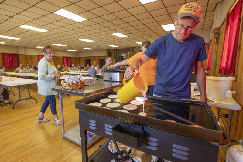 Ken Arndi prepares a batch of pancakes on the griddle during the breakfast buffet Sunday, Sept. 1, 2024, at the American Legion before the Chuck Rolinski's Labor Day Bocce Tournament in Toluca.