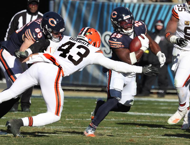 Chicago Bears running back Kyle Monangai avoids the tackle of Cleveland Browns linebacker Mohamoud Diabate during their game Sunday, Dec. 14, 2025, at Soldier Field in Chicago.