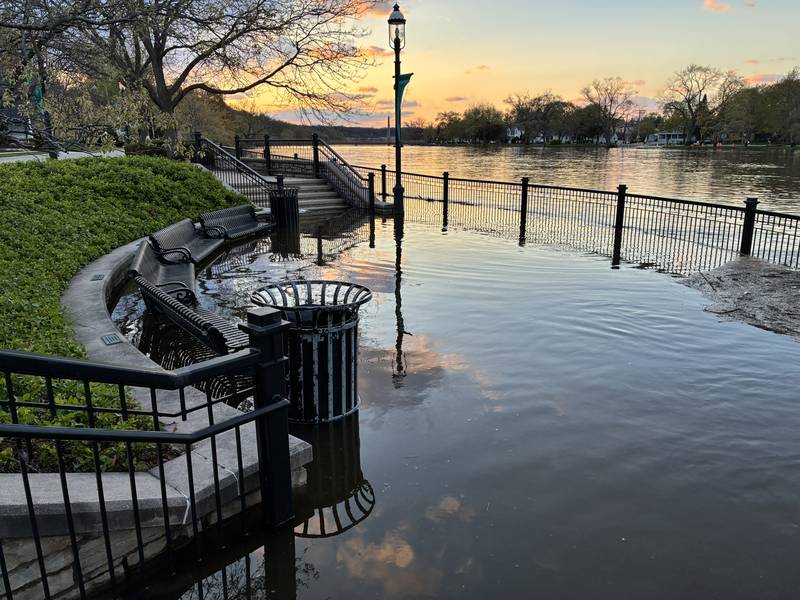 The Fox River with overflowing banks is seen along the West Dundee riverwalk on Sunday, April 19, 2026.