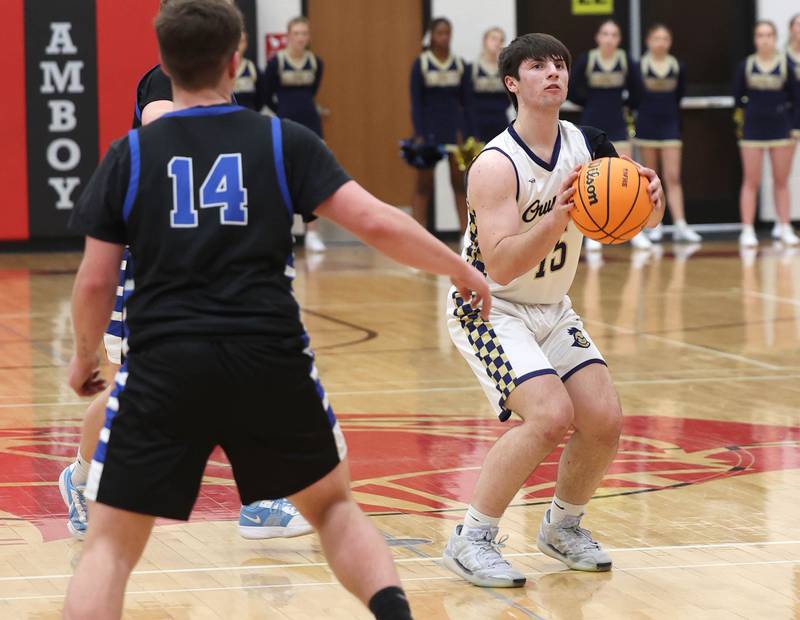 Marquette's Alec Novotney shoots a deep three-pointer in front of Hinckley-Big Rock's Austin Roop Tuesday, March 3, 2026, during their sectional semifinal matchup at Amboy High School.