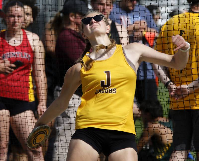 Jacobs’ Carly Uehlein throws the discus on Thursday, April 23, 2026, during the McHenry County Track and Field Meet at McCracken Field in McHenry.