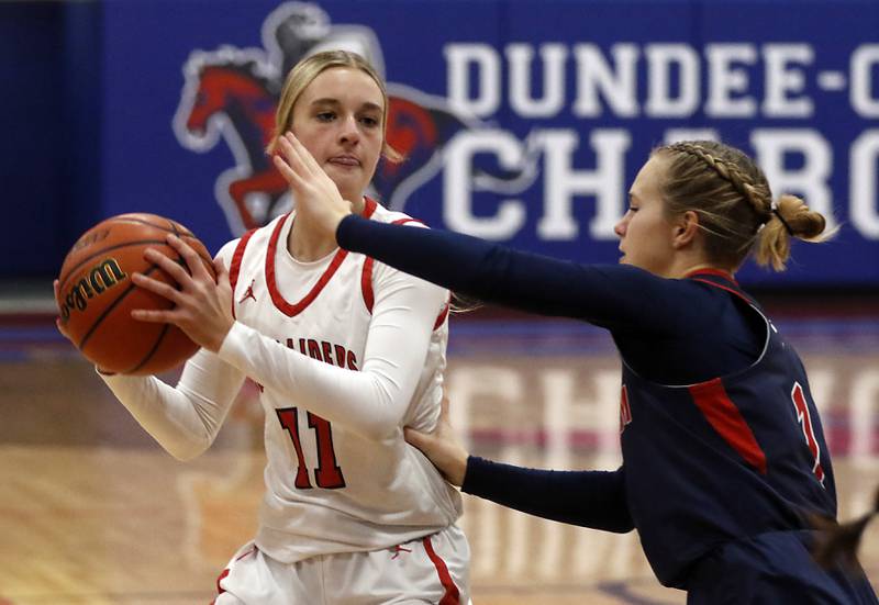 Huntley’s Anna Campanelli looks to drive against South Elgin’s Addison Tinerella on Tuesday, Nov. 21, 2023, during a basketball game in the Dundee-Crown High School Girls Thanksgiving Tournament in Carpentersville.