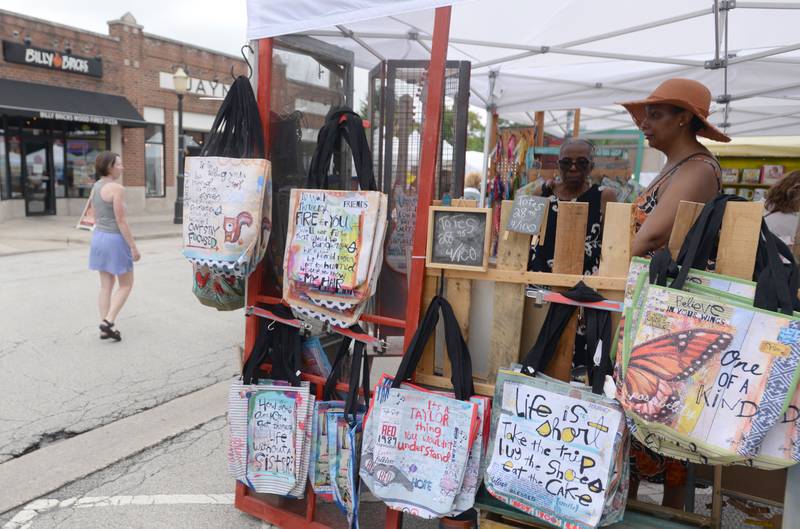 (left) Laura Shanklin of Bellwood and Takeisha Monet of Berwyn look inside one of the booths during the annual La Grange Craft Fair Saturday July 12, 2025.