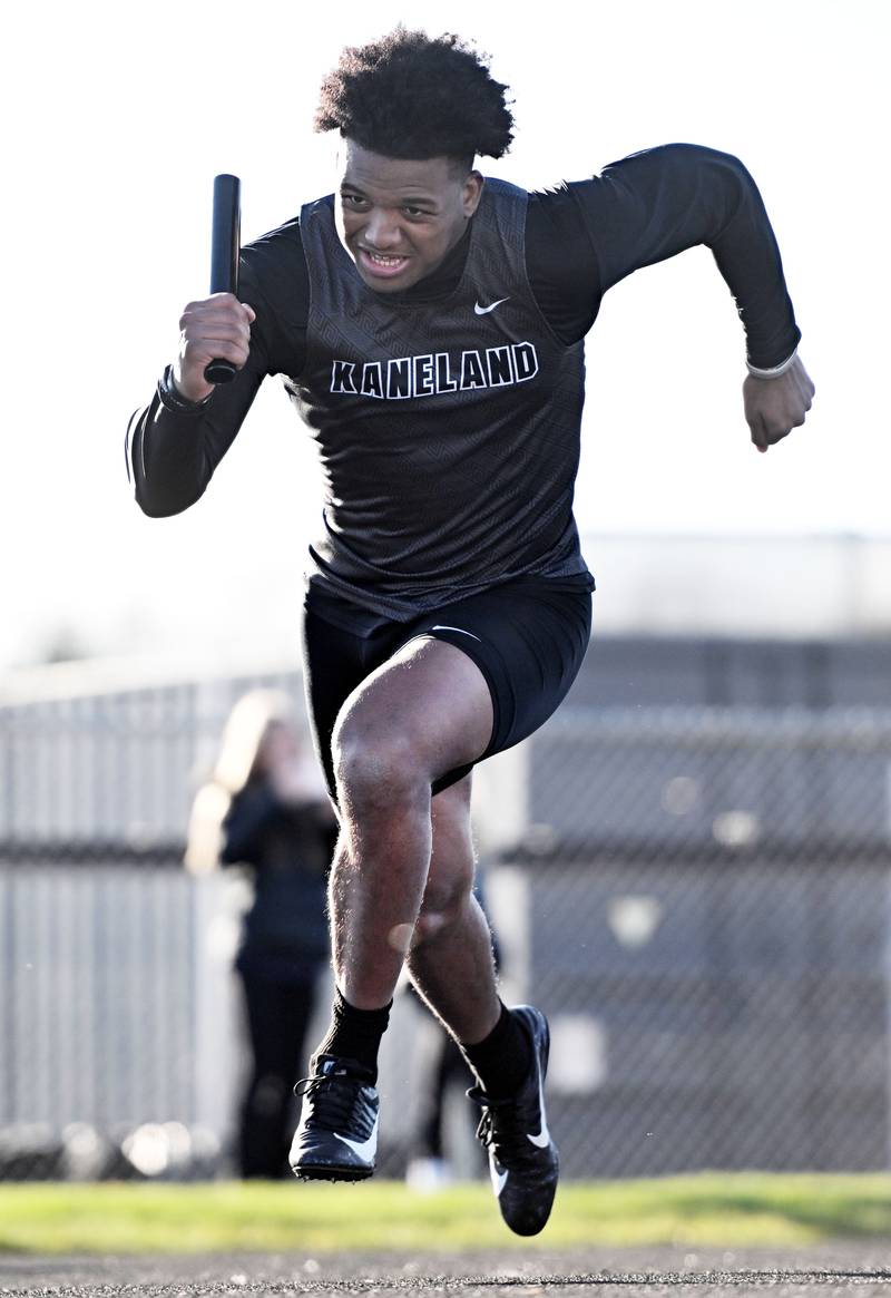 Kaneland’s Aric Johnson starts the 800-meter relay at the Les Hodge Boys Track and Field Invitational at Batavia High School on Friday, April 5, 2024.