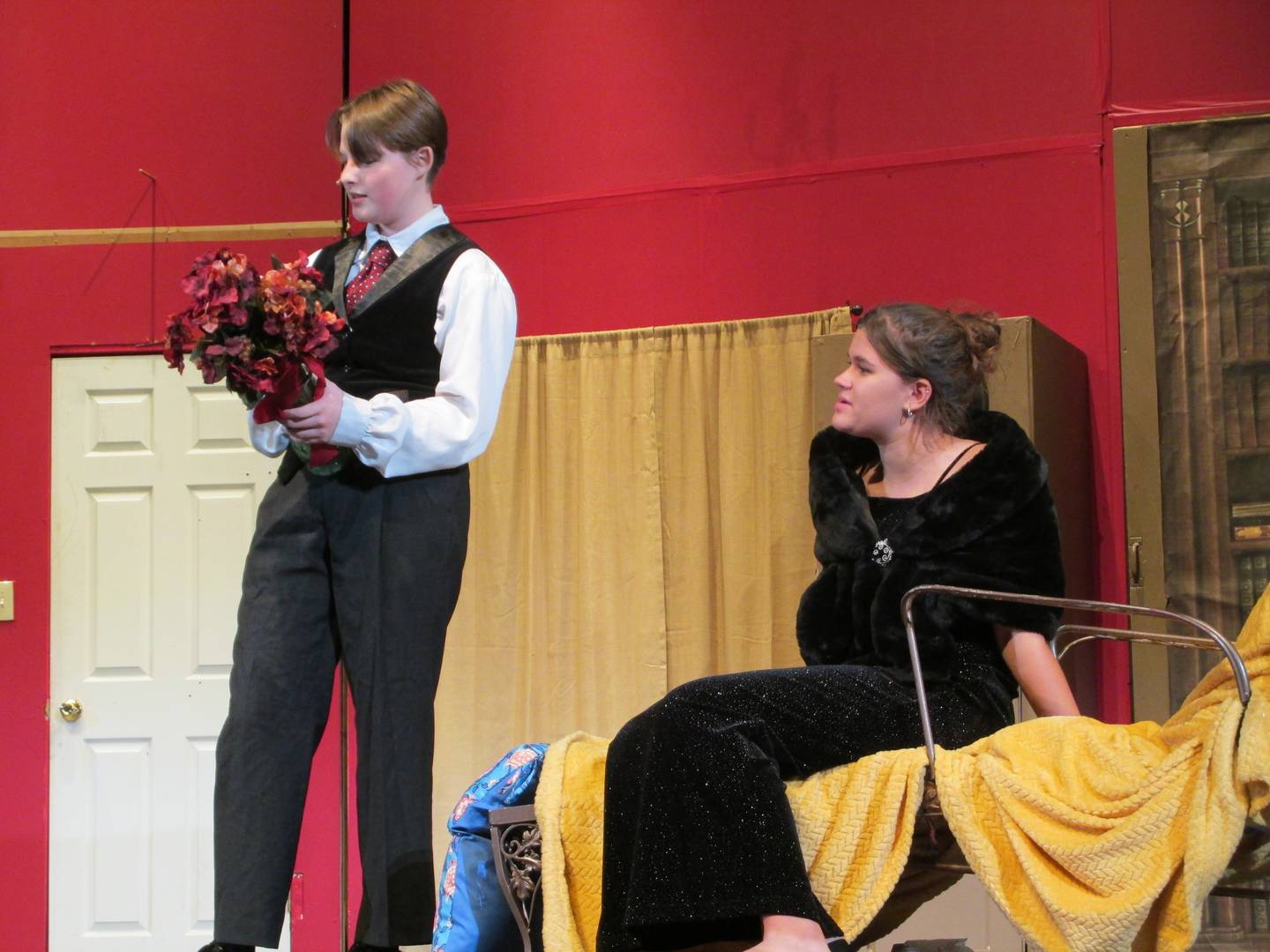Olivia Smith as the inspector and Charlie Bourell as Florence Colleymoore rehearse a scene in Streator High School's "The Play That Goes Wrong."