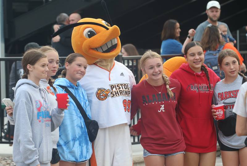 Pistol Shrimp fans pose with South Claw Sam on Wednesday, Aug. 2, 2023 at Schweickert Stadium in Peru.