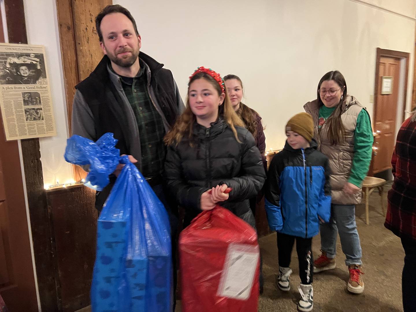 Nick Holtz, his three children Fiona, Calista and Benson Holtz and his wife Gina Holtz became Goodfellows on Dec. 24, 2024, by delivering gifts for the local charitable organization for the first time.