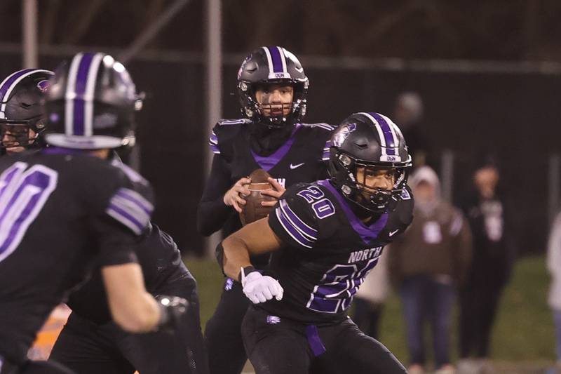 Downers Grove North’s Owen Lansu looks to pass against Mt. Carmel in the Class 7A championship on Saturday, Nov. 25, 2023 at Hancock Stadium in Normal.