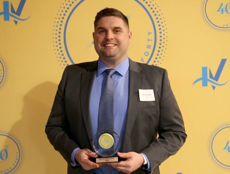 Nick McLaughlin poses for a photo with his award during the 40 Under Forty awards banquet on Thursday, March 21, 2024 at Westclox in Peru.