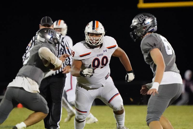 Oswego’s Joshua Flores (99) during a football game against Oswego East at Oswego East High School on Friday, October 25, 2024.