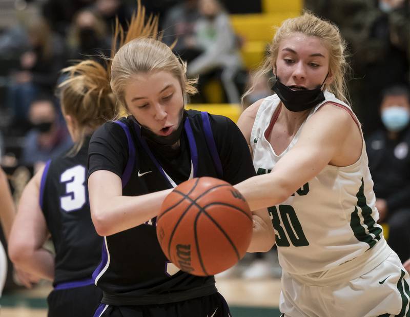 Hampshire's Avery Cartee and Crystal Lake South's Hanna Massie battle for a rebound during their game on Friday, January 14, 2022 at Crystal Lake South High School.