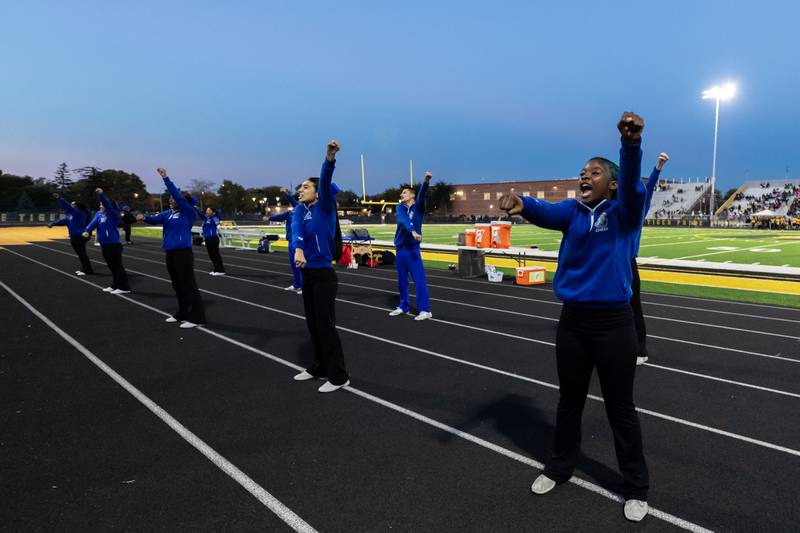 Joliet Central’s cheer team hypes-up the crowd during a varsity football game between Joliet West and Joliet Central at Joliet West on Oct. 24, 2025.