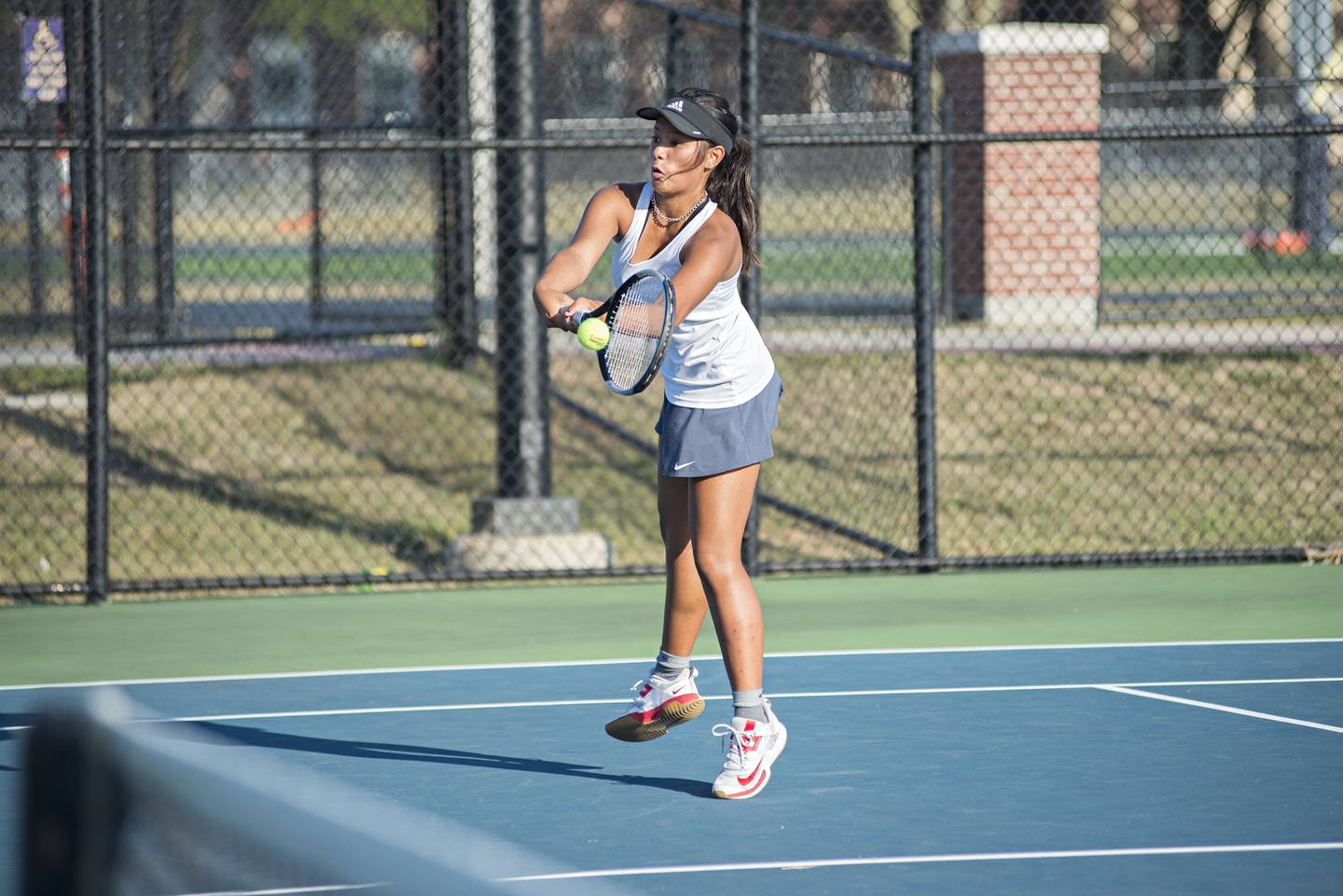 Sterling's Layla Tablante returns a shot while playing in a doubles match with teammate Anna Meltzer.