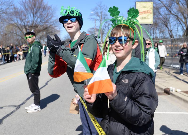 (left) Ben Illingworth and his brother Liam of Glen Ellyn enjoy attending the Elmhurst St. Patrick's Day Parade Saturday, March 9, 2024.