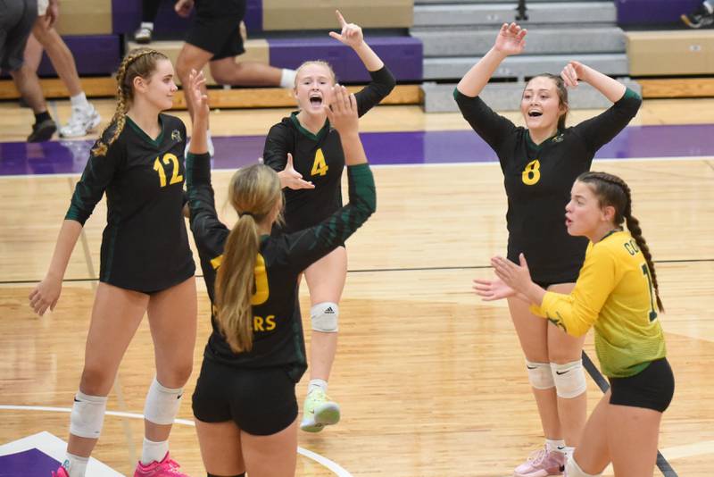 Members of the Coal City girls volleyball team celebrate a point during a game at Wilmington Thursday, Sept. 25, 2025.