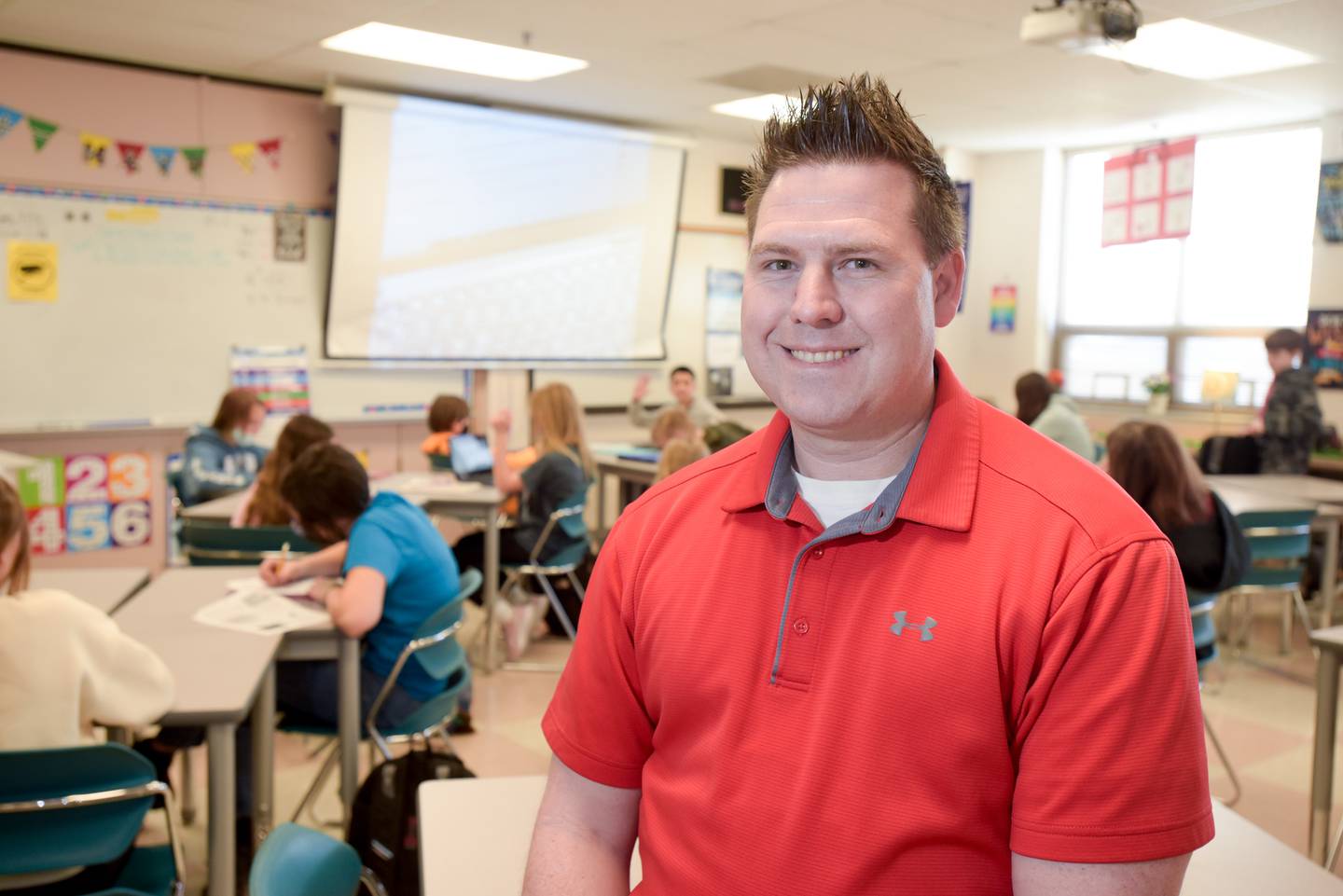 Patrick McGuire, former assistant principal, decided to return to the classroom this year at Wredling Middle School in St. Charles in order to reconnect with students.