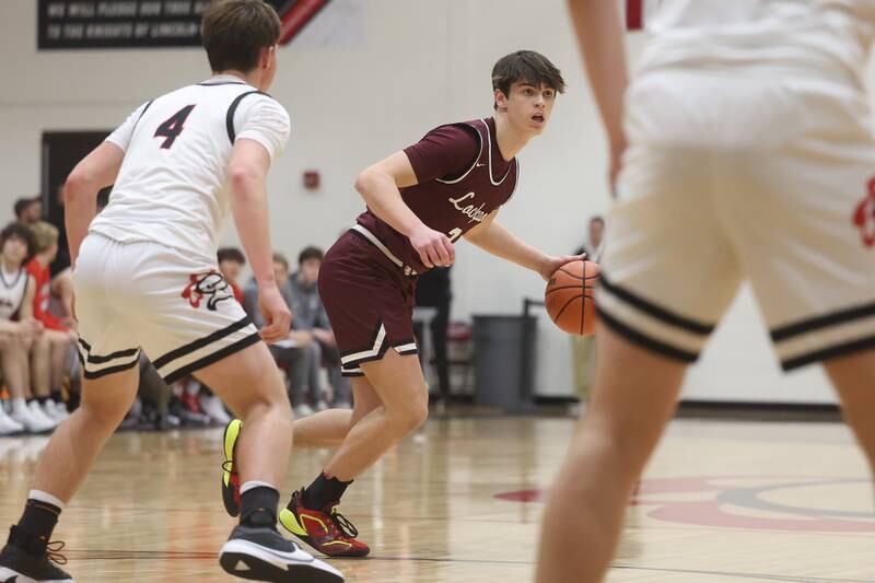 Lockport’s Logan Cooper looks for a play against Lincoln-Way Central on Tuesday, Jan. 23rd, 2024 in New Lenox.
