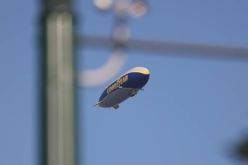 The Good Year blimp passes over Joliet during the Wine, Jazz and Arts Fest at Bicentennial Park in Joliet on Saturday, Aug. 19, 2023.