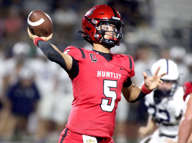 Huntley’s Malik Carter fires a pass against Cary-Grove in varsity football at Huntley High School in Huntley on Friday, Sept. 19, 2025.