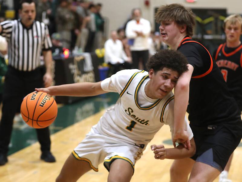 Crystal Lake South's Noah Cook drives the baseline against McHenry's Nate Ottaway during a Fox Valley Conference boys basketball game on Wednesday, Jan. 14, 2026, at Crystal Lake South High School.