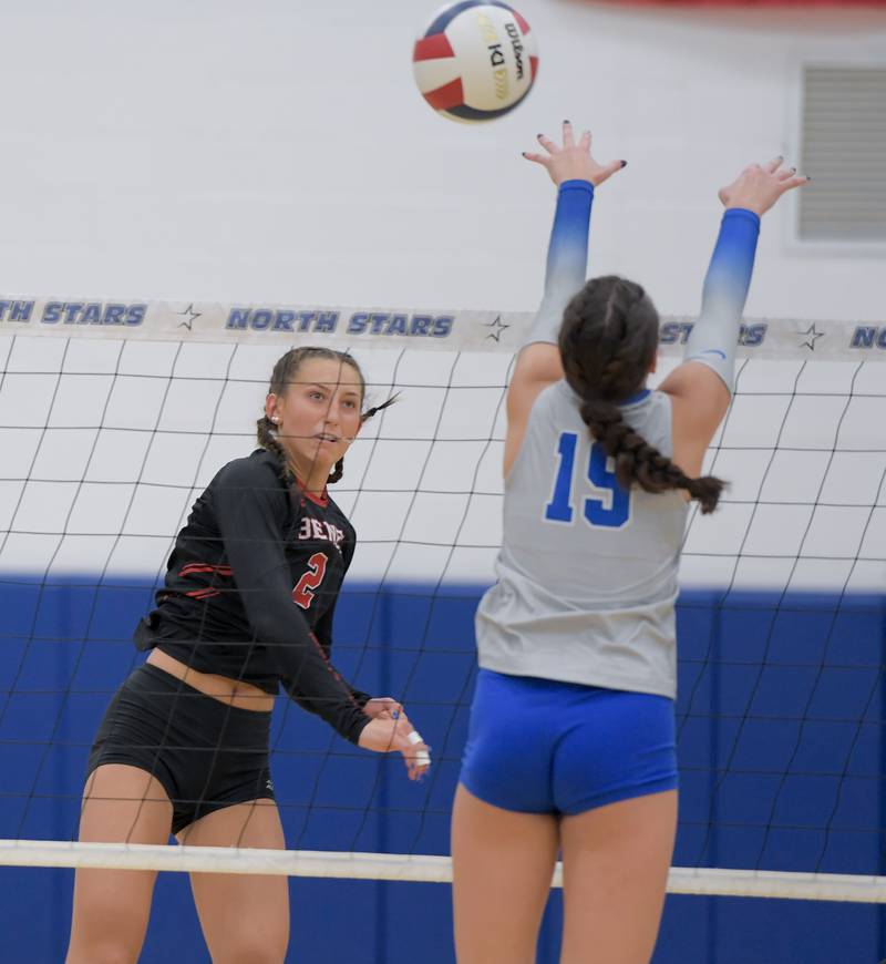 Benet's Gabby Stasys (2) hits the ball past St. Charles North's Alex Bardouniotis (19) during a game on Wednesday, September 20, 2023.