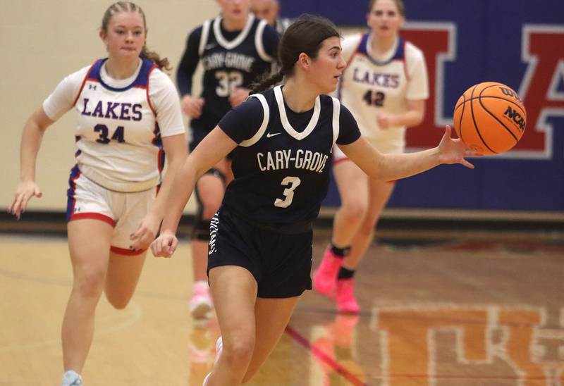 Cary-Grove’s Kennedy Manning moves the ball against Lakes in varsity girls basketball action on Friday, Jan. 2, 2026  at Lakes High School in Lake Villa.