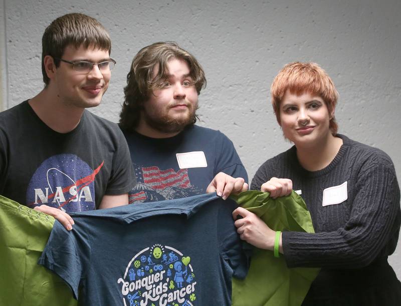 Shavees (from left) Aaron Noble, Daniel Taglia and Avriel Miers  pose for a photo before having their head shaved during the first ever St. Baldrick's event on Wednesday, April 30, 2025 at Illinois Valley Community College.