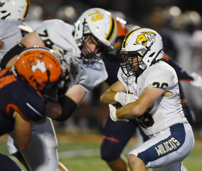 Joe Lewnard/jlewnard@dailyherald.com
Neuqua Valley’s Silvano Spatafora carries the ball during Friday’s game at Naperville North.