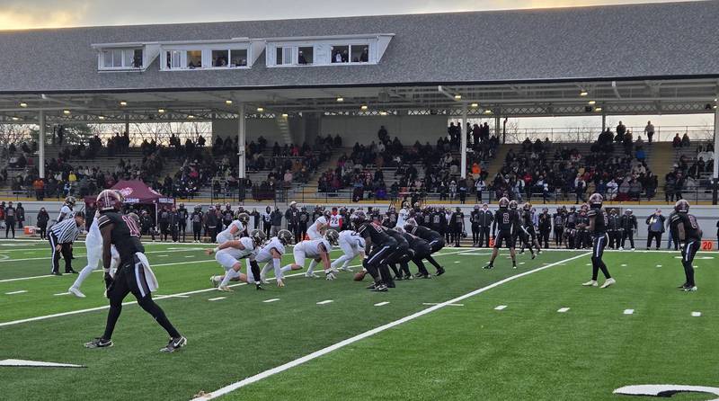 The Joliet Catholic Academy defense readies for a snap from Peoria High in the second quarter of Saturday's Class 5A quarterfinal playoff game at Peoria Stadium.