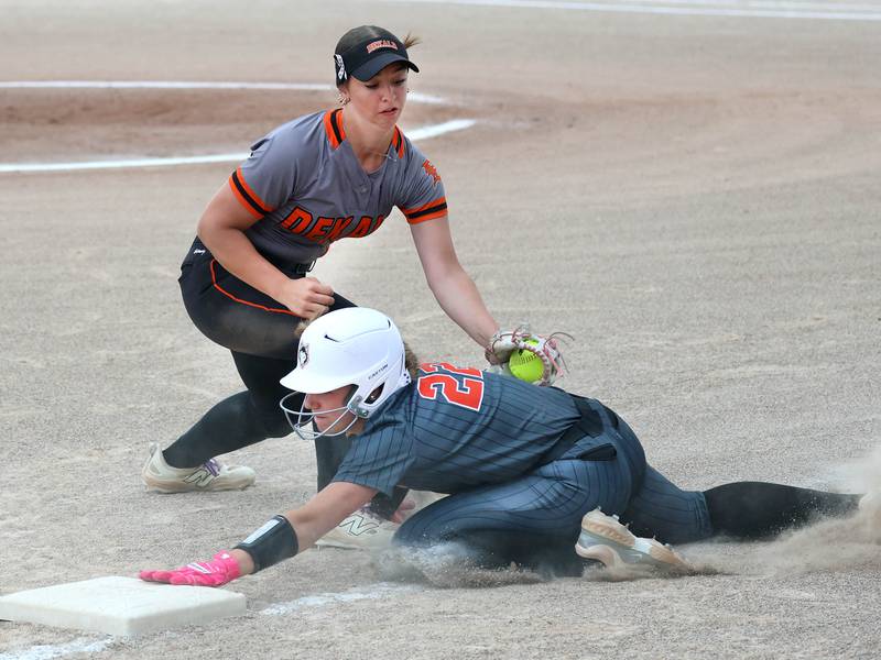 DeKalb's Kennedy Latimer puts the late tag on Harlem's Adriah Sholl on a close play at third Tuesday, May 19, 2026, during their Class 4A regional game at DeKalb High School.