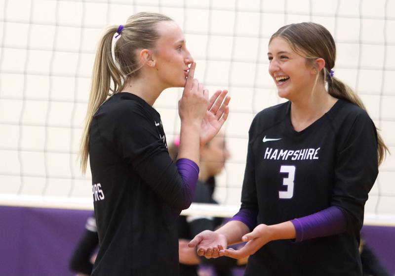 Hampshire’s Elizabeth King, left, and Lily Ingve react after a Whip-Pur point against Prairie Ridge in varsity girls volleyball at Hampshire High School in Hampshire on Tuesday, Sept. 2, 2025.