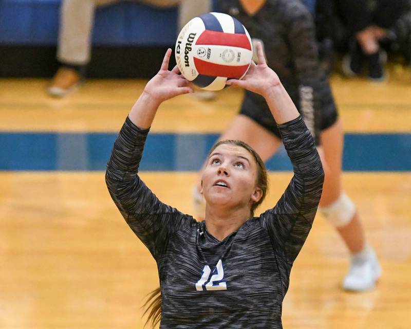 St. Francis's Jenna Glaudel (12) sets the ball during the game on Wednesday Oct. 2, 2024, while taking on St. Charles North held at St. Francis High School in Wheaton.