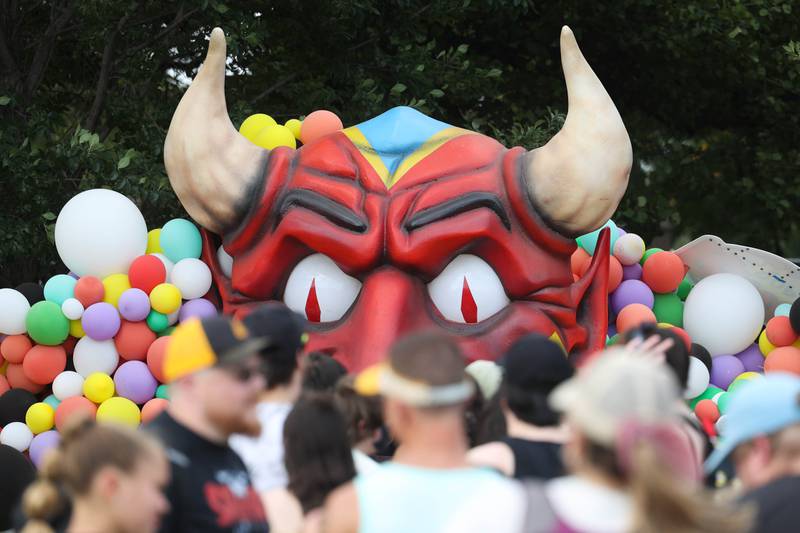 Festival goers line up to take pictures in front of the Riot Fest prop on day two of Riot Fest. Saturday, Sept. 18, 2022, in Chicago.