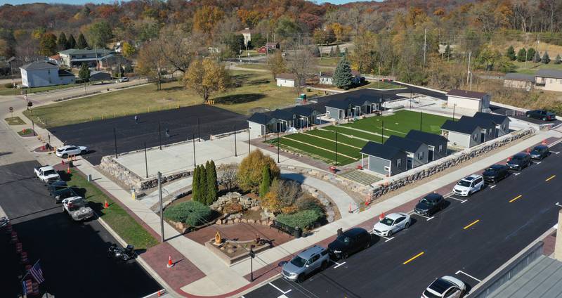 The Market on Mill retail plaza in Utica is progressing nicely. An aerial view shows crews installing outdoor turf at the site on Friday, Nov. 1, 2024 downtown Utica. Overhead lighting was strung above the huts this week. The project is in it's final stage of completion.
