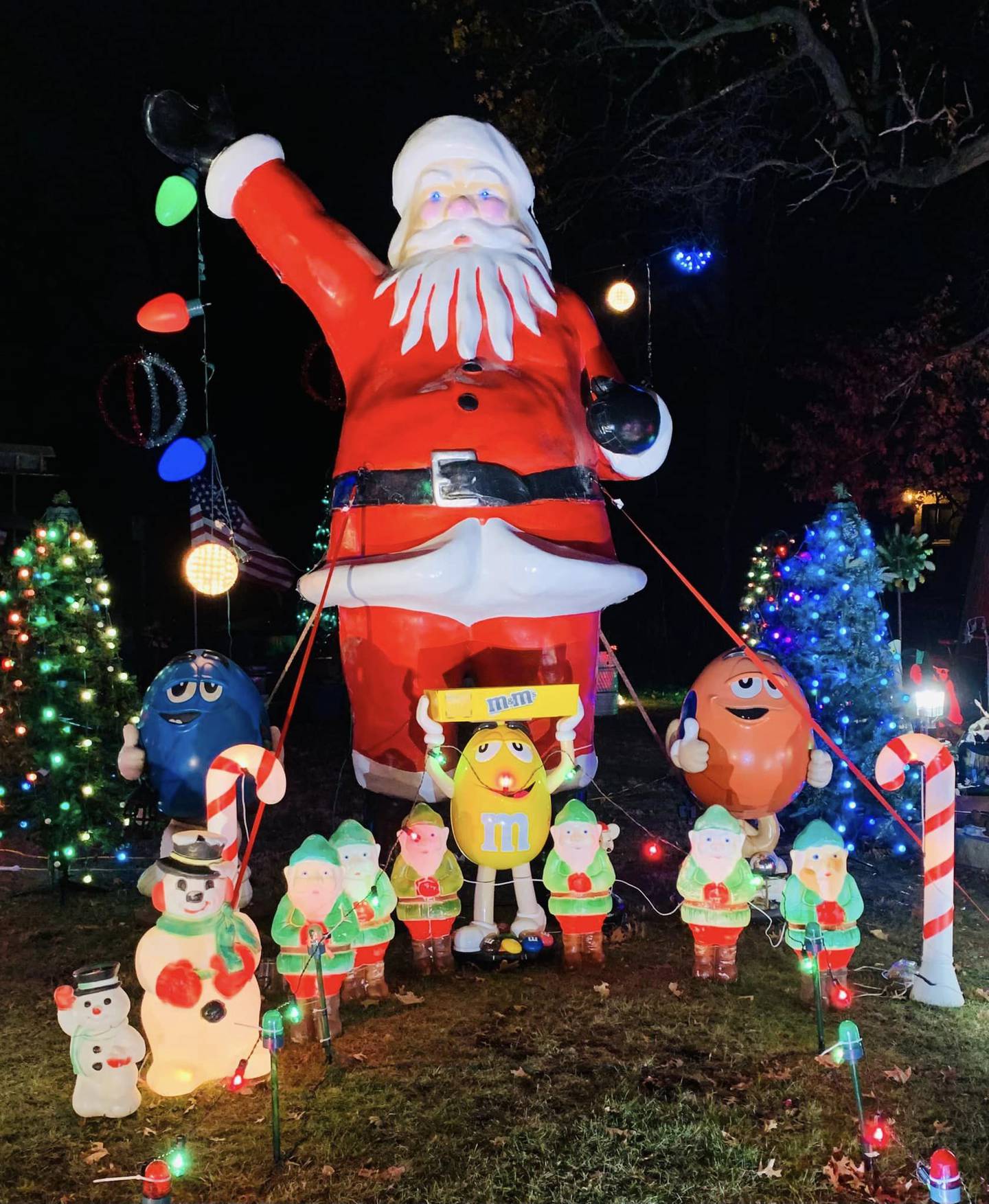 Jacci Richards-Click and her husband, Dan Click, collected food donations for the Family Health Partnership Clinic at the Clickmas Christmas display at 401 W. Woodstock Street, Crystal Lake, seen here in December 2022.