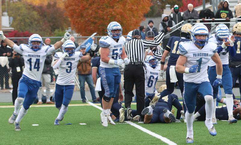 Princeton players (from left) Jack Oester, Lane Goskusky, Eli Burden and Casey Etheridge react after getting a fumble from Central Catholic during the Class 3A playoffs on Saturday, Nov. 1, 2025 at Central Catholic High School in Bloomington.