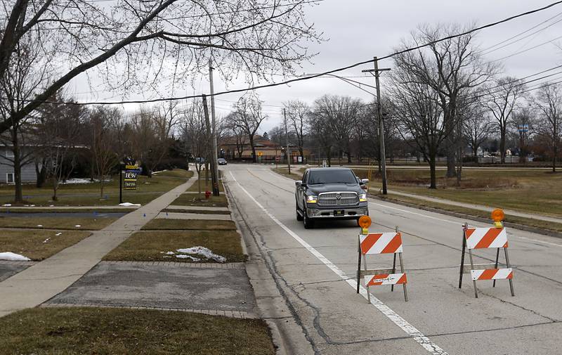 Barricades block a section of Dole Avenue near Eagle Street in Crystal Lake where a power line was hanging closer to the road on Thursday, Feb. 23, 2023, as county residents recover from a winter storm that knocked down trees and created power outages throughout McHenry County.