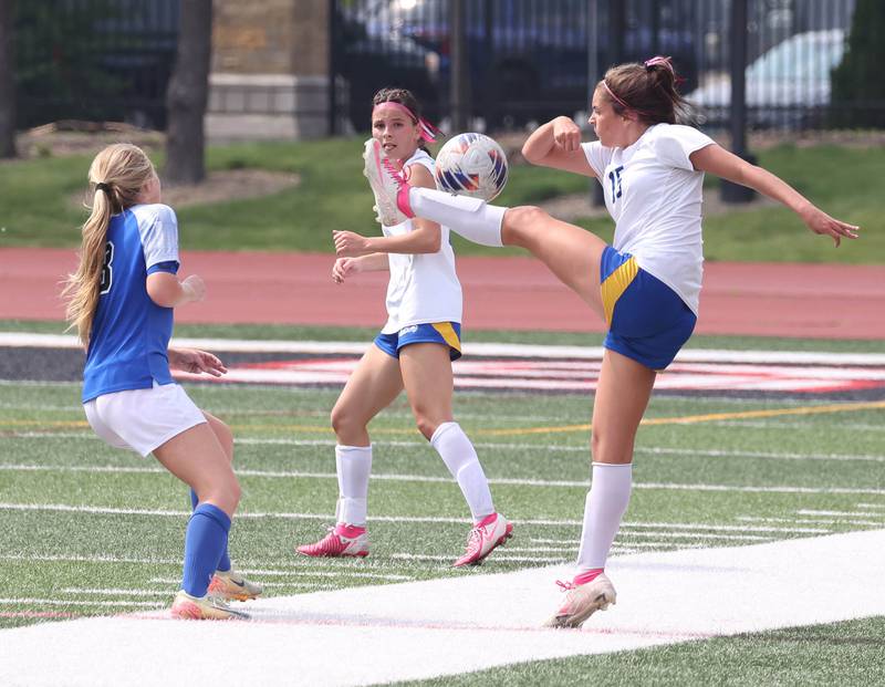 Johnsburg's Lauren McQuiston kicks the ball in front of Columbia's Riley Mathews Saturday, June 7, 2025, during the IHSA Class 1A state championship game at North Central College in Naperville.