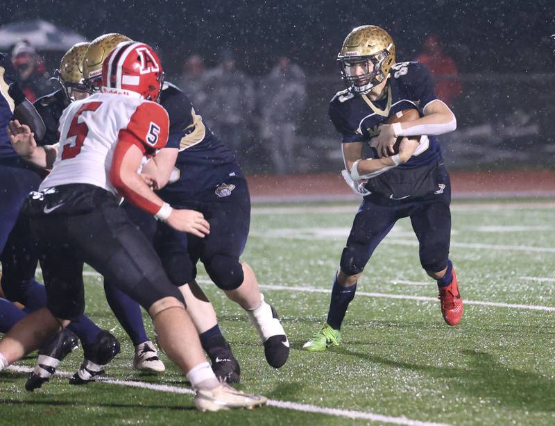 Polo's Mercer Mumford looks to get outside of Amboy/LaMoille/Ohio's Ryan McNinch during the 8-man I8FA championship game on Friday, Nov. 21, 2025 at April Zorn Memorial Stadium in Monmouth.