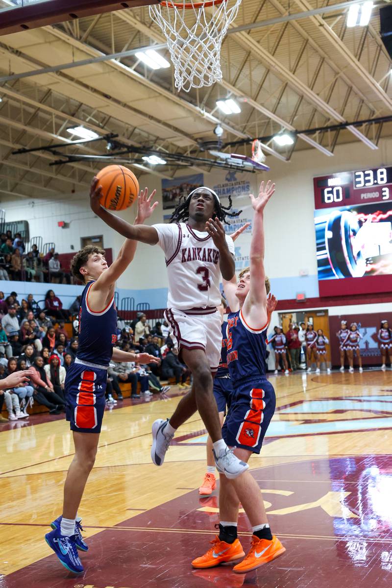 Kankakee's Cedric Terrell III evades defenders to score during the Kays' 74-60 victory over Mahomet-Seymour on Tuesday, Dec. 2, 2025.
