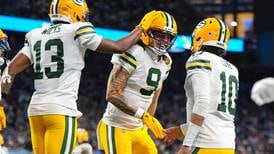 Love matches career high with 4 TD passes, lifting Packers to 31-24 win over Lions