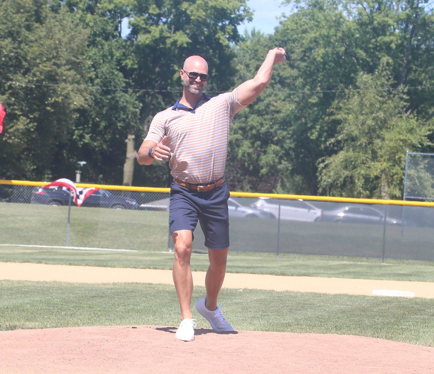Former Major League Baseball pitcher J.A. Happ throws out the first pitch of the St. Bede alumni game during the J.A. Happ Day and field dedication on Sunday, July 30, 2023 at Washington Park in Peru.