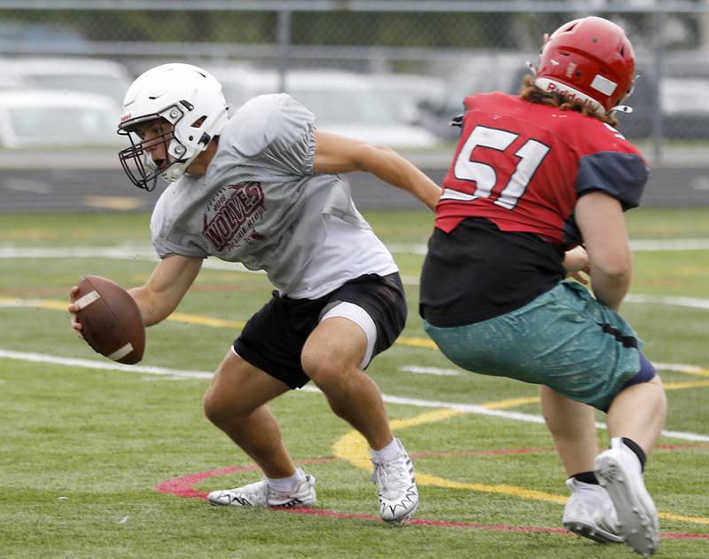 Prairie Ridge quarterback Luke Vanderwiel escapes the pass rush during football practice against Grant on Thursday, July 17, 2025, at Grant High School in Fox Lake.