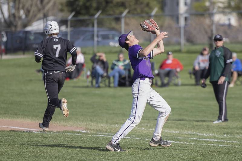Dixon’s Alex Harrison fields a pop-up for an out against Rock Falls on Tuesday, April 18, 2023.