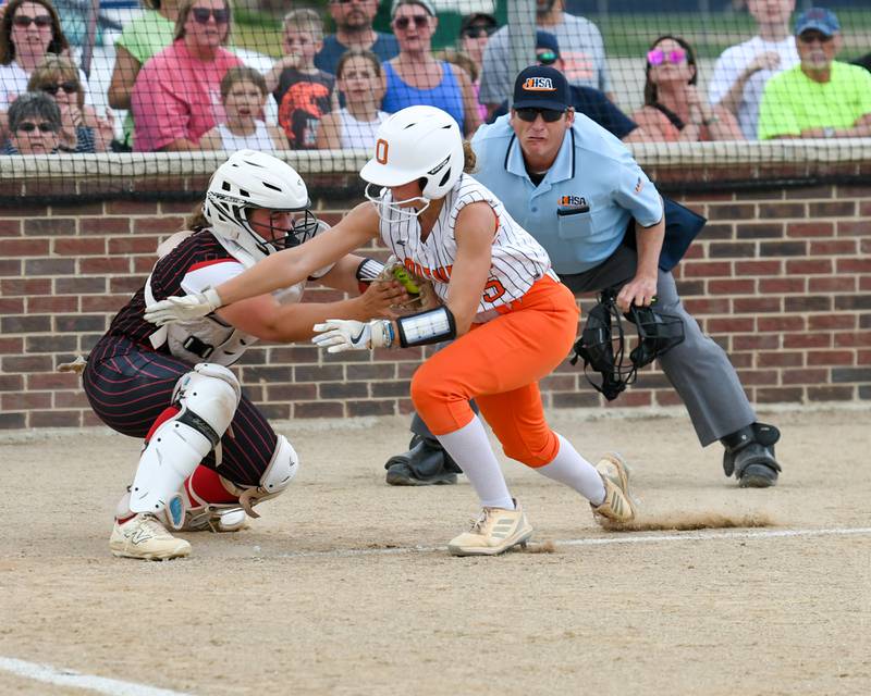 Yorkville's catcher Kayla Kersting, left, tags out Oswego's Adalynn Fugitt (5) for an out at home plate during the sectional semifinal game on Tuesday June 3, 2025, held at Oswego High School.