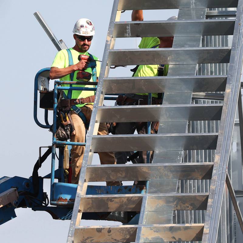 Irving Construction employees work on the roof of the new DeKalb fire station Wednesday, Sept. 18, 2024, at 1130 South Malta Road in DeKalb. Construction on the station, the fourth for the DeKalb Fire Department, is ongoing.