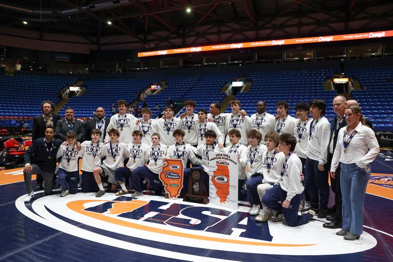 IC Catholic poses with the IHSA Class 2A Dual Team State championship trophy following their victory over Providence Catholic on Saturday, Feb. 28, 2026.