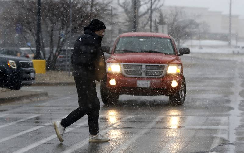 A shopper walks into the Johnsburg Walmart store as a winter storm moves through McHenry County on Tuesday, Jan. 9, 2024, delivering snow to most of the county.